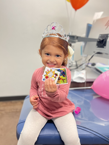 Caring for Dental Crowns Happy Wilmington Patient with Prizes